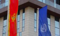 The Montenegrin flag and the UN flag.